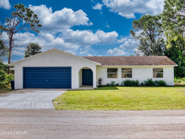 ranch-style house with a garage and a front yard