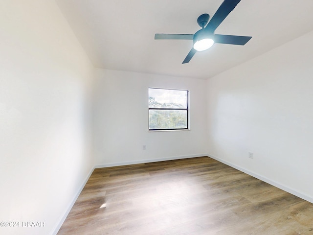 empty room featuring wood-type flooring and ceiling fan