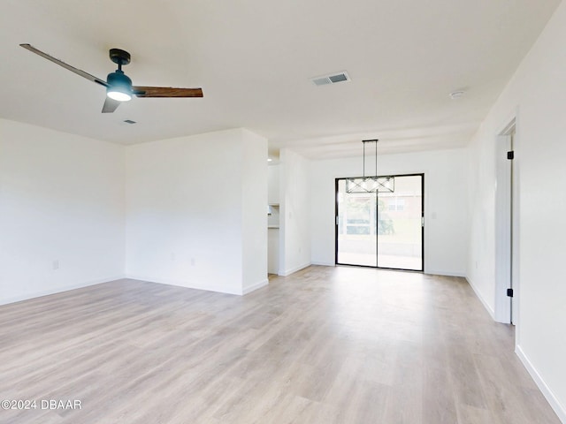 unfurnished room featuring light wood-type flooring and ceiling fan