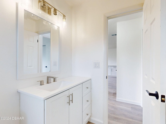 bathroom with wood-type flooring and vanity