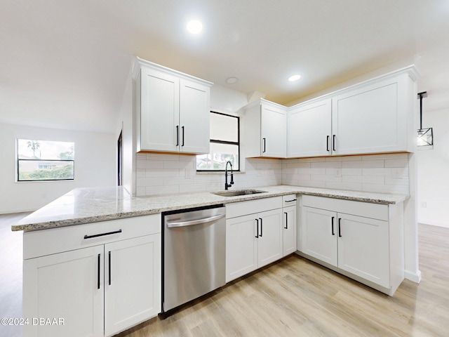 kitchen featuring white cabinetry, light wood-type flooring, pendant lighting, sink, and dishwasher