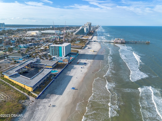 drone / aerial view featuring a view of the beach and a water view