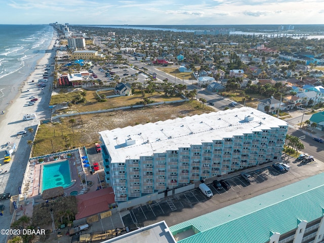 bird's eye view featuring a view of the beach and a water view