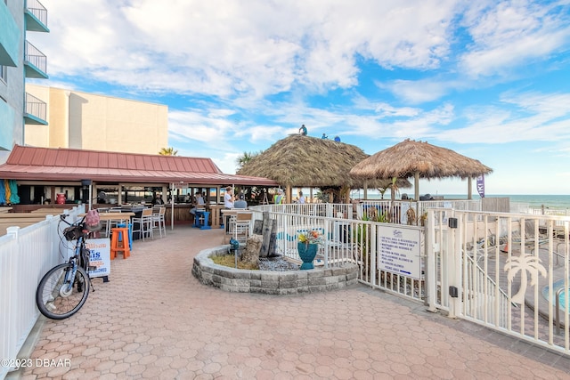 view of patio / terrace featuring a gazebo and a water view