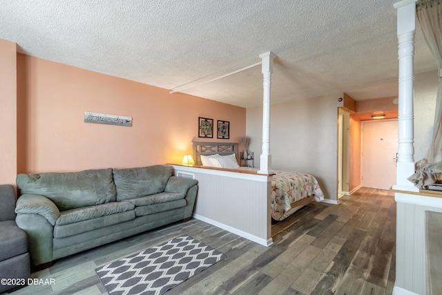 bedroom featuring a textured ceiling and hardwood / wood-style flooring