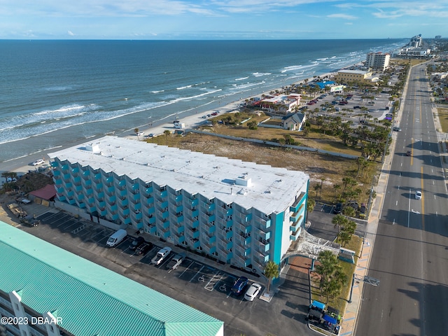 birds eye view of property featuring a view of the beach and a water view