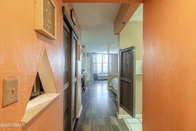 hallway with wood-type flooring