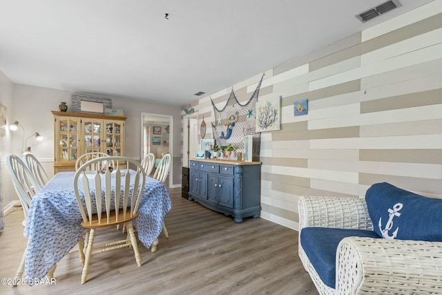 dining room with wood-type flooring