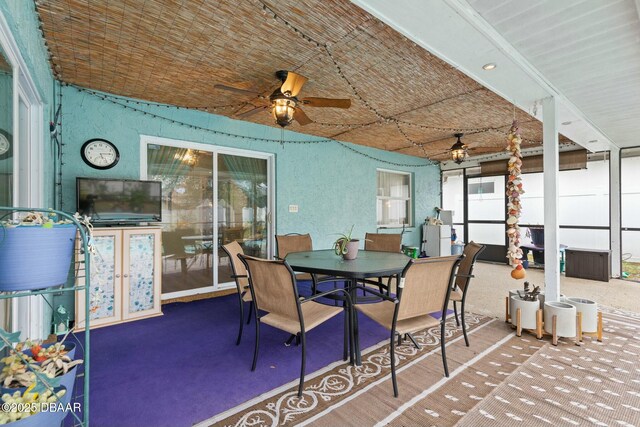 interior space with ceiling fan and a wealth of natural light