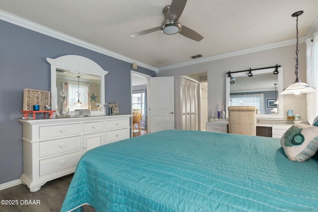 bedroom featuring ornamental molding, ceiling fan, multiple windows, and a textured ceiling