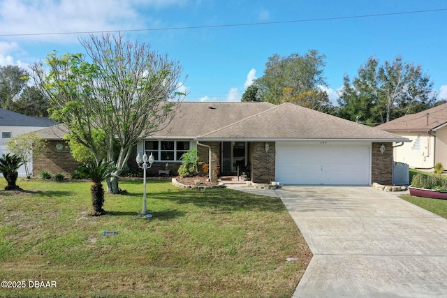 single story home with a garage and a front lawn