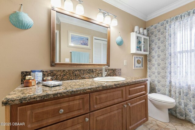 bathroom with toilet, crown molding, and vanity