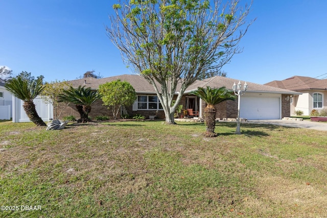 single story home featuring a front lawn and a garage