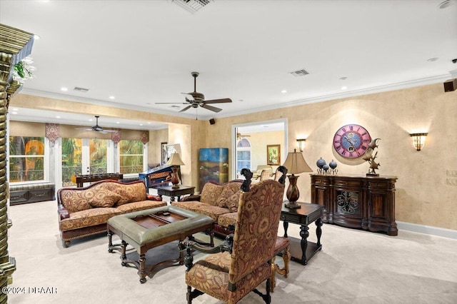 carpeted living room featuring ceiling fan and crown molding