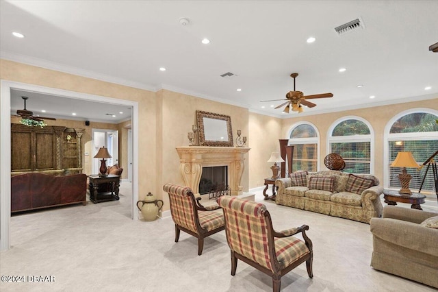 living room featuring ceiling fan and crown molding