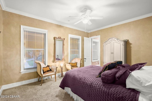 carpeted bedroom with ceiling fan and crown molding