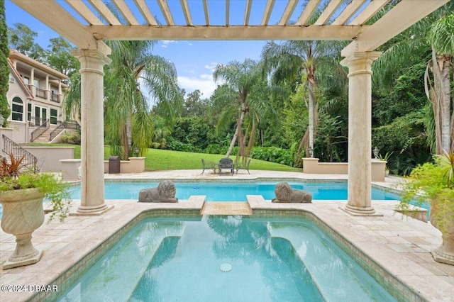 view of pool featuring a patio, a pergola, and an in ground hot tub