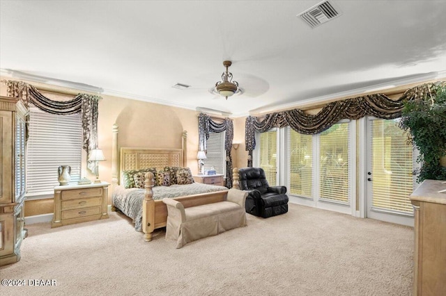 carpeted bedroom with ceiling fan, access to exterior, and ornamental molding