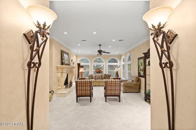 living room featuring ceiling fan and crown molding