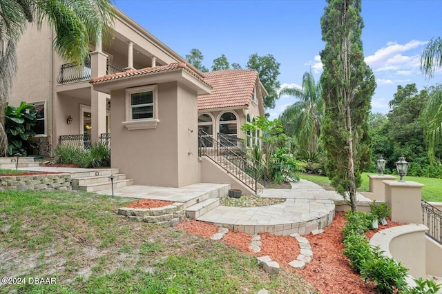 view of property exterior featuring a balcony