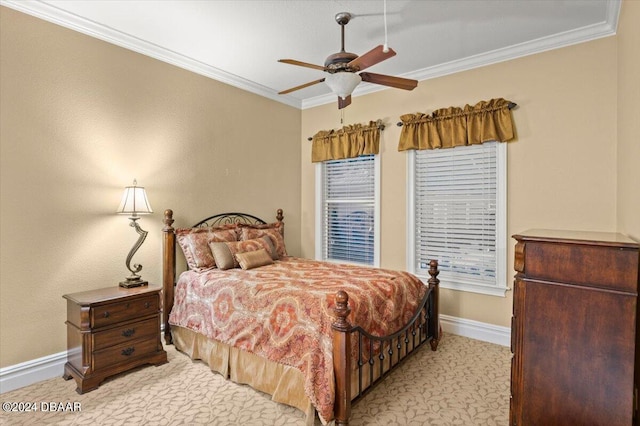 bedroom with ceiling fan and crown molding