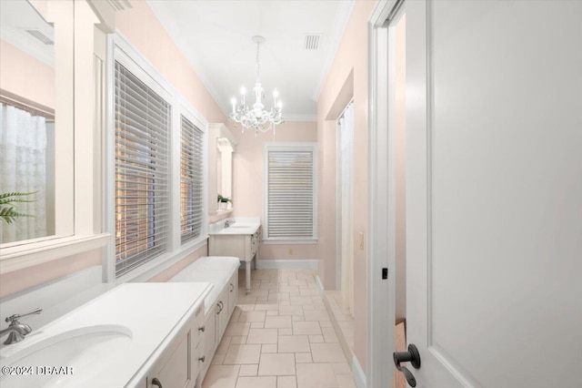 bathroom featuring tile patterned floors, vanity, a wealth of natural light, and a notable chandelier