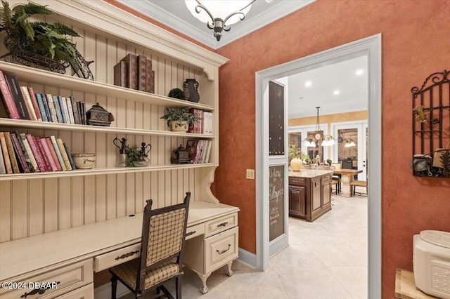 tiled office space with built in desk, an inviting chandelier, and ornamental molding