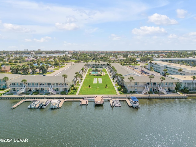 birds eye view of property with a water view