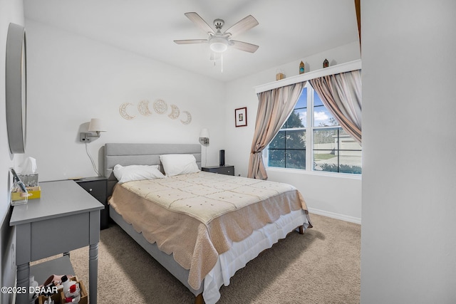 carpeted bedroom featuring a ceiling fan and baseboards