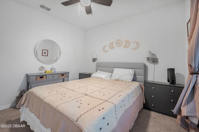 carpeted bedroom featuring ceiling fan, visible vents, and baseboards