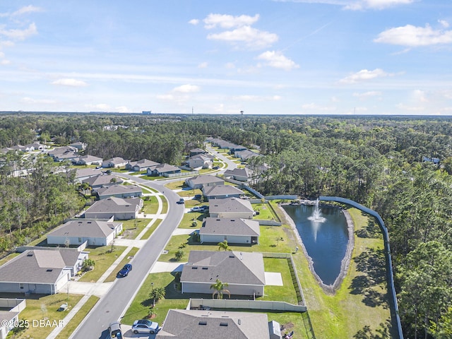 bird's eye view featuring a residential view and a water view