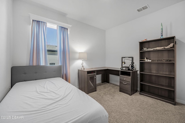 bedroom featuring light colored carpet, visible vents, and baseboards