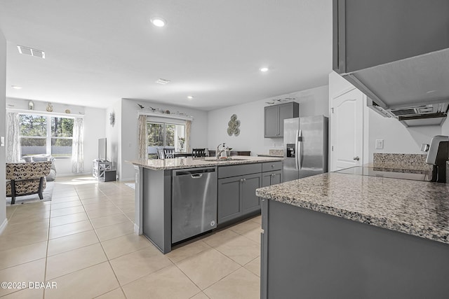 kitchen featuring a sink, stainless steel appliances, gray cabinets, and visible vents