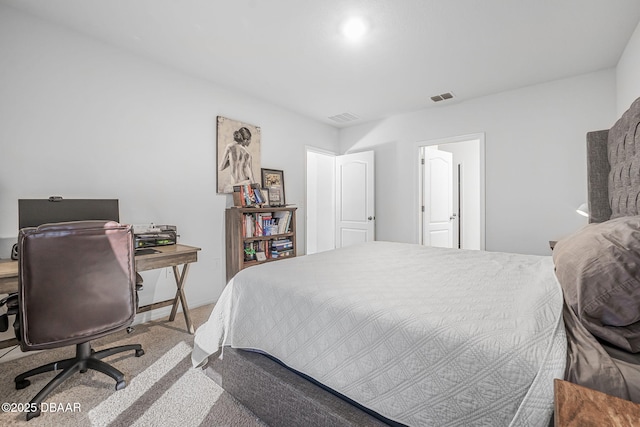 bedroom featuring carpet floors and visible vents