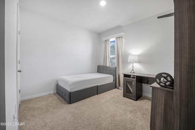 bedroom with carpet flooring and baseboards