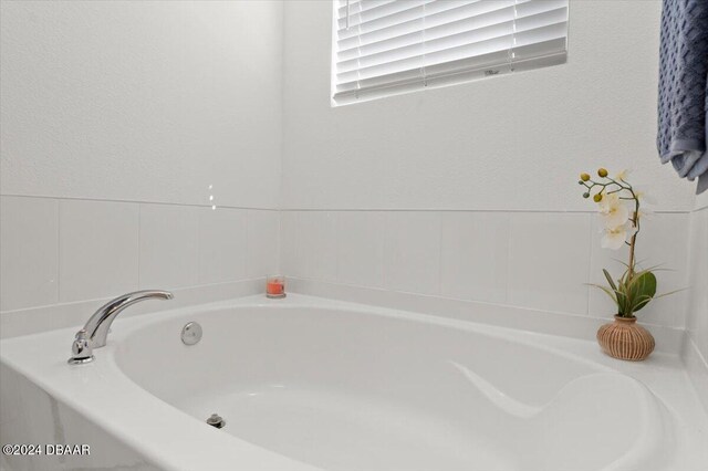 bathroom featuring a tub