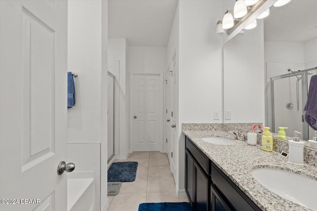 bathroom featuring vanity, tile patterned flooring, and an enclosed shower