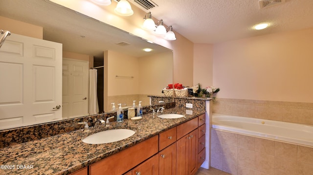 full bath featuring a sink, a bath, and visible vents