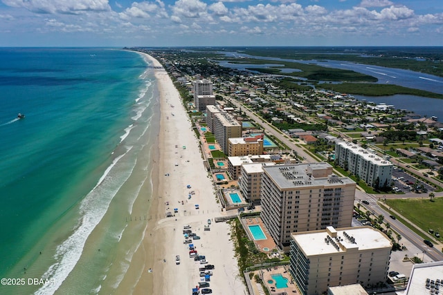 drone / aerial view featuring a view of the beach and a water view
