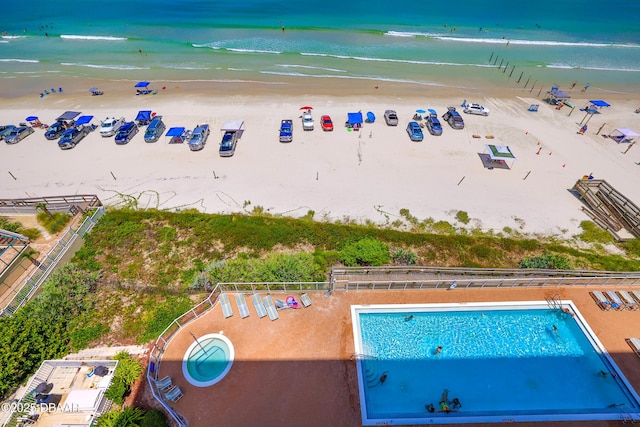drone / aerial view with a view of the beach and a water view