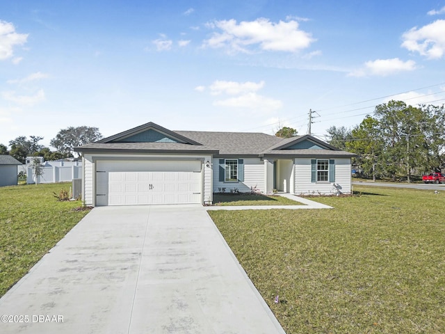 ranch-style house with a garage and a front yard