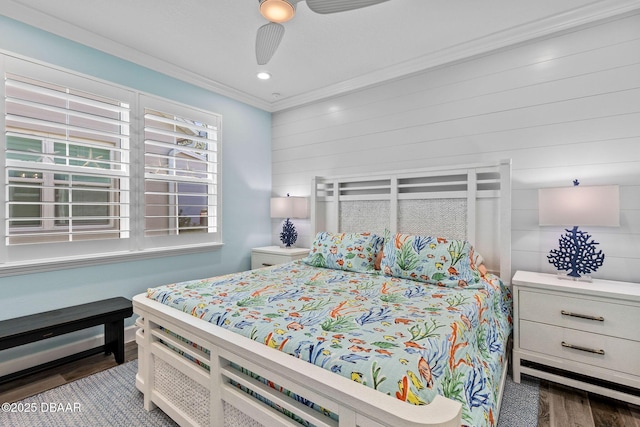 bedroom with ornamental molding, dark hardwood / wood-style floors, and ceiling fan