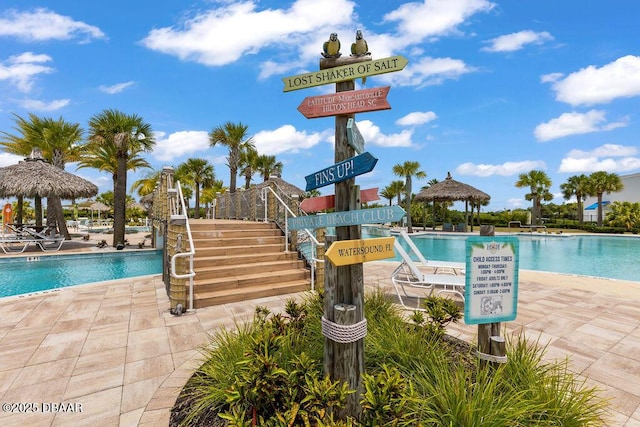 view of swimming pool featuring a gazebo and a patio area