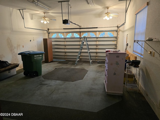 garage with ceiling fan and a garage door opener