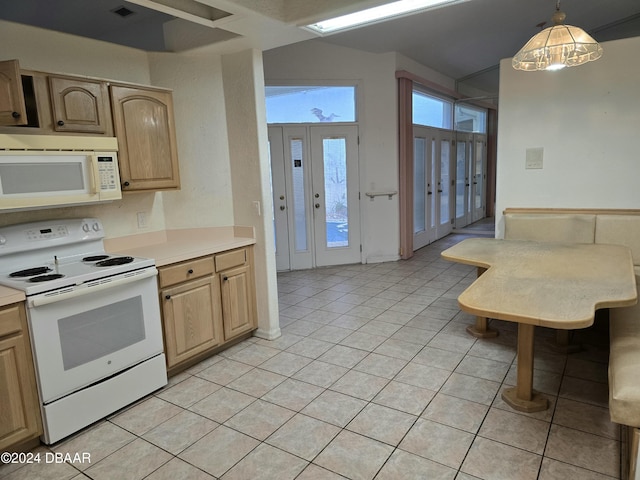 kitchen featuring light tile patterned flooring, pendant lighting, white appliances, and light brown cabinets