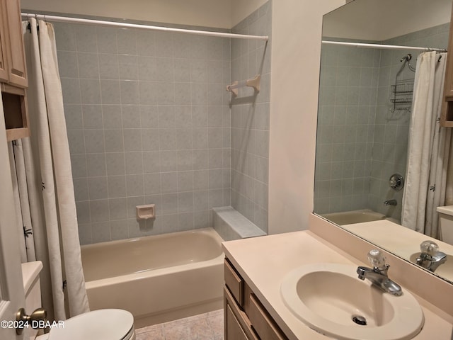 full bathroom with tile patterned flooring, vanity, shower / tub combo, and toilet