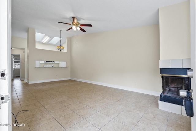 1518 Franklin Cir, Holly Hill, FL 32117 - unfurnished living room featuring ceiling fan, light tile patterned floors, lofted ceiling, and baseboards