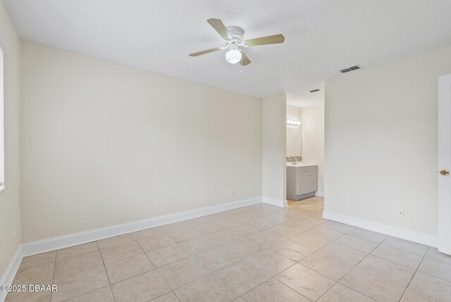 1518 Franklin Cir, Holly Hill, FL 32117 - unfurnished room with ceiling fan, light tile patterned floors, and baseboards