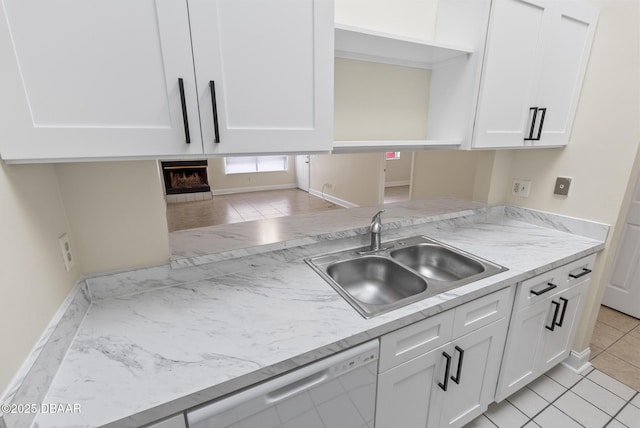 1518 Franklin Cir, Holly Hill, FL 32117 - kitchen featuring a sink, white cabinetry, stainless steel dishwasher, open shelves, and baseboards