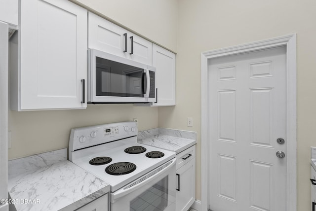 1518 Franklin Cir, Holly Hill, FL 32117 - kitchen featuring white electric range oven and white cabinets